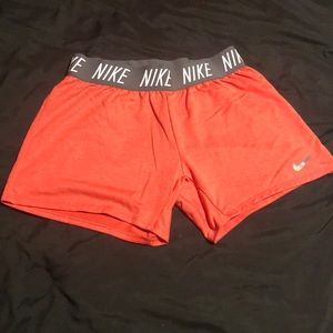 Nike red athletic shorts- size large
